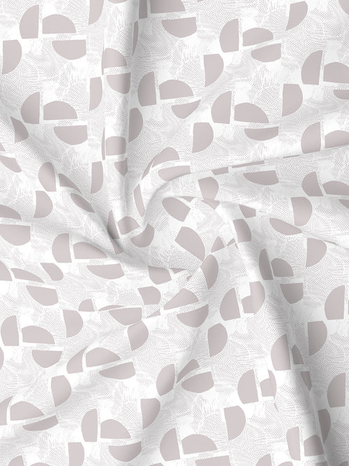 Fabric with abstract pattern of gray shapes on a white background